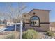 Charming single-story home with a barrel tile roof, arched window, and desert landscaping at 1203 E Judi St, Casa Grande, AZ 85122