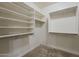 Walk-in closet with built-in shelving and hanging racks for ample storage at 1203 E Judi St, Casa Grande, AZ 85122