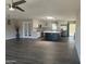 Bright open-concept kitchen features a large island, stainless appliances, and modern pendant lighting at 12415 W Rock Springs Dr, Sun City West, AZ 85375