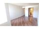 Spacious bedroom showcases wood laminate floors and an attached bathroom with a white vanity at 1331 W Baseline Rd # 257, Mesa, AZ 85202