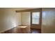 Well-lit bedroom featuring wood flooring and window at 1331 W Baseline Rd # 257, Mesa, AZ 85202