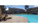 Inviting community pool with surrounding lounge chairs at 1331 W Baseline Rd # 257, Mesa, AZ 85202