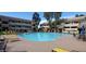 Community pool with lounge chairs and patio tables at 1331 W Baseline Rd # 257, Mesa, AZ 85202