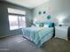 Bedroom with king bed, window, and bedside tables at 13709 W Gunsight Dr, Sun City West, AZ 85375