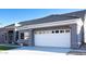 Two-car garage and front entryway of a single story home at 13709 W Gunsight Dr, Sun City West, AZ 85375