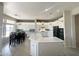 Modern kitchen with white cabinets, island, and breakfast nook at 13709 W Gunsight Dr, Sun City West, AZ 85375