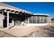 Covered patio and screened enclosure with built-in grill at 13709 W Gunsight Dr, Sun City West, AZ 85375