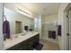 Double vanity bathroom with a large walk-in shower at 14870 W Encanto Blvd # 1014, Goodyear, AZ 85395