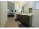 Double vanity bathroom with a view of the bedroom at 14870 W Encanto Blvd # 1014, Goodyear, AZ 85395