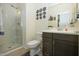 Bathroom with shower, toilet and dark wood vanity at 14870 W Encanto Blvd # 1014, Goodyear, AZ 85395