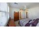 Secondary bedroom with a barn door and ceiling fan at 14870 W Encanto Blvd # 1014, Goodyear, AZ 85395