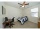 Bedroom with a desk and ceiling fan at 14870 W Encanto Blvd # 1014, Goodyear, AZ 85395