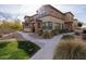 Front view of tan two-story home with walkway at 14870 W Encanto Blvd # 1014, Goodyear, AZ 85395