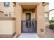 Home entrance with gate and landscaping at 14870 W Encanto Blvd # 1014, Goodyear, AZ 85395