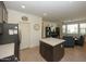 Kitchen with island and open living area at 14870 W Encanto Blvd # 1014, Goodyear, AZ 85395