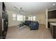 Bright living room features tile floors, comfy seating, and a ceiling fan at 14870 W Encanto Blvd # 1014, Goodyear, AZ 85395