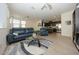 Living room with blue sofa and open floor plan at 14870 W Encanto Blvd # 1014, Goodyear, AZ 85395