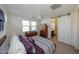 Main bedroom with barn door leading to the bathroom at 14870 W Encanto Blvd # 1014, Goodyear, AZ 85395