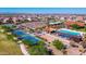 Aerial view of community pool,pickleball courts, and playground at 18094 W Sand Hills Dr, Surprise, AZ 85387