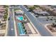 Aerial view of community pool, spa, shuffleboard courts, and surrounding homes at 1885 E Sycamore E Rd, Casa Grande, AZ 85122