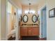 Well-lit bathroom with double sinks, granite countertop, and tile floors at 1885 E Sycamore E Rd, Casa Grande, AZ 85122