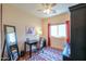 Bedroom features a ceiling fan, area rug, full-length mirror and a window at 1885 E Sycamore E Rd, Casa Grande, AZ 85122