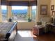 Bedroom with a bay window seat and view of the scenic desert landscape at 1885 E Sycamore E Rd, Casa Grande, AZ 85122