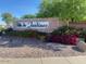 Villa de Jardines entrance sign with colorful landscaping and trees at 1885 E Sycamore E Rd, Casa Grande, AZ 85122