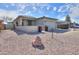 Charming single-story home features a well-maintained front yard, and a two-car garage at 1885 E Sycamore E Rd, Casa Grande, AZ 85122