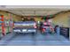 Spacious garage featuring a truck, golf cart, ladder and storage at 1885 E Sycamore E Rd, Casa Grande, AZ 85122