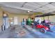 Spacious garage featuring a golf cart, sink, and storage at 1885 E Sycamore E Rd, Casa Grande, AZ 85122