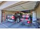 Spacious garage featuring a truck, golf cart, ladder and storage at 1885 E Sycamore E Rd, Casa Grande, AZ 85122