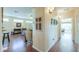 Hallway with hardwood floors leading to living areas and a bedroom at 1885 E Sycamore E Rd, Casa Grande, AZ 85122