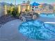 Community hot tub featuring waterfall rocks and lush landscaping at 1885 E Sycamore E Rd, Casa Grande, AZ 85122