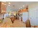 Bright, open kitchen flows into the living room featuring stainless appliances and granite countertops at 1885 E Sycamore E Rd, Casa Grande, AZ 85122