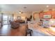 Open-concept kitchen with granite counters seamlessly connects to the living room at 1885 E Sycamore E Rd, Casa Grande, AZ 85122