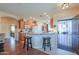 Open kitchen featuring granite counters, a breakfast bar, and oak cabinets at 1885 E Sycamore E Rd, Casa Grande, AZ 85122