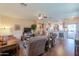 Spacious living room seamlessly connects to the kitchen and entryway, hardwood floors at 1885 E Sycamore E Rd, Casa Grande, AZ 85122