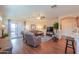 Spacious living room with hardwood floors seamlessly connects to the back patio at 1885 E Sycamore E Rd, Casa Grande, AZ 85122