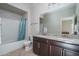 Bathroom boasts double vanity, granite countertop, and shower/tub combo at 21370 N 260Th Ln, Buckeye, AZ 85396