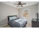 Cozy bedroom with a double bed, nightstand, and TV at 21370 N 260Th Ln, Buckeye, AZ 85396