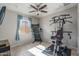 Home gym with Bowflex machine and treadmill at 21370 N 260Th Ln, Buckeye, AZ 85396