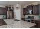 Modern kitchen island with granite countertops and stainless steel appliances at 21370 N 260Th Ln, Buckeye, AZ 85396