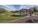 Community park with grassy area and covered picnic tables at 21370 N 260Th Ln, Buckeye, AZ 85396