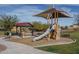 Community playground with covered picnic area at 21370 N 260Th Ln, Buckeye, AZ 85396