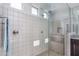 Walk-in shower with built-in seat and glass enclosure at 21370 N 260Th Ln, Buckeye, AZ 85396