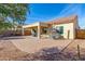 Spacious backyard with covered patio, seating, and brick pavers at 2303 N General Dr, Florence, AZ 85132