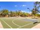 Full-sized outdoor basketball court with painted lines and lighting at 2303 N General Dr, Florence, AZ 85132