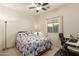 Comfortable bedroom with a queen bed, desk, and ceiling fan at 2303 N General Dr, Florence, AZ 85132