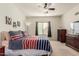 Bedroom with TV and striped bedding at 2303 N General Dr, Florence, AZ 85132